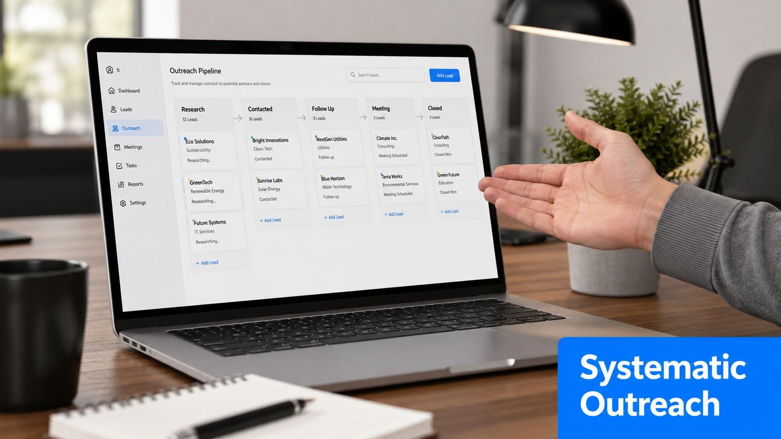 A person gesturing towards a laptop screen showing a business outreach pipeline management software dashboard.